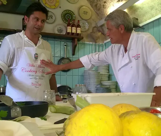 The chef and the cooking master in the kitchen