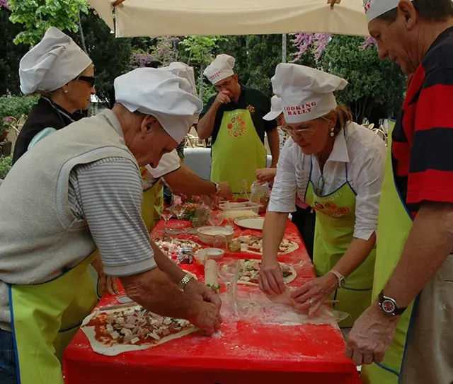 The pizza table with students in chef hats